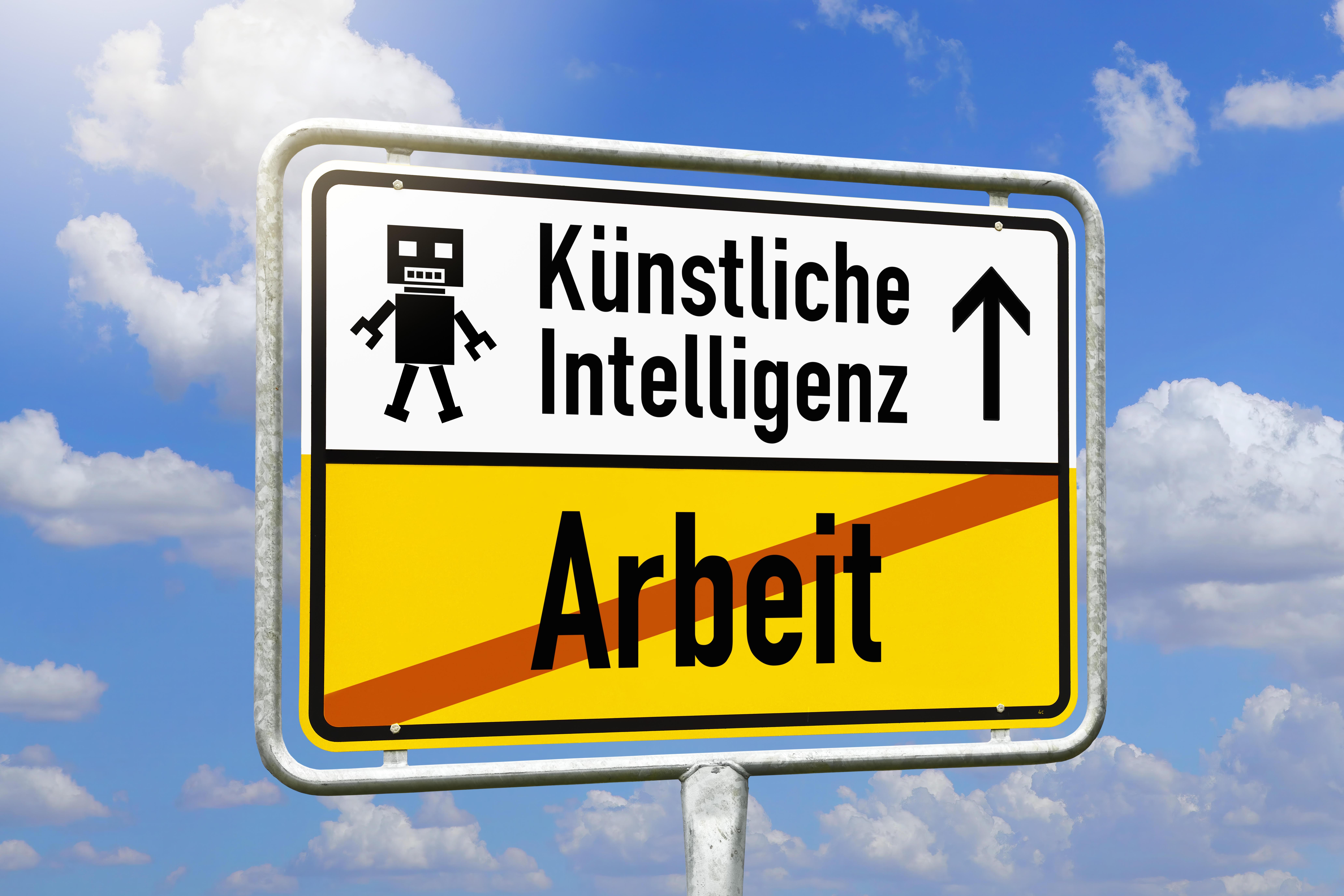 Schild mit Aufschrift Künstliche Intelligenz und durchgestrichener Aufschrift Arbeit 