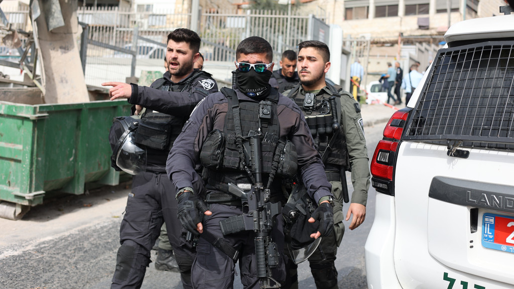 Police officers close the area of a shooting attack near a synagogue in East of Jerusalem.