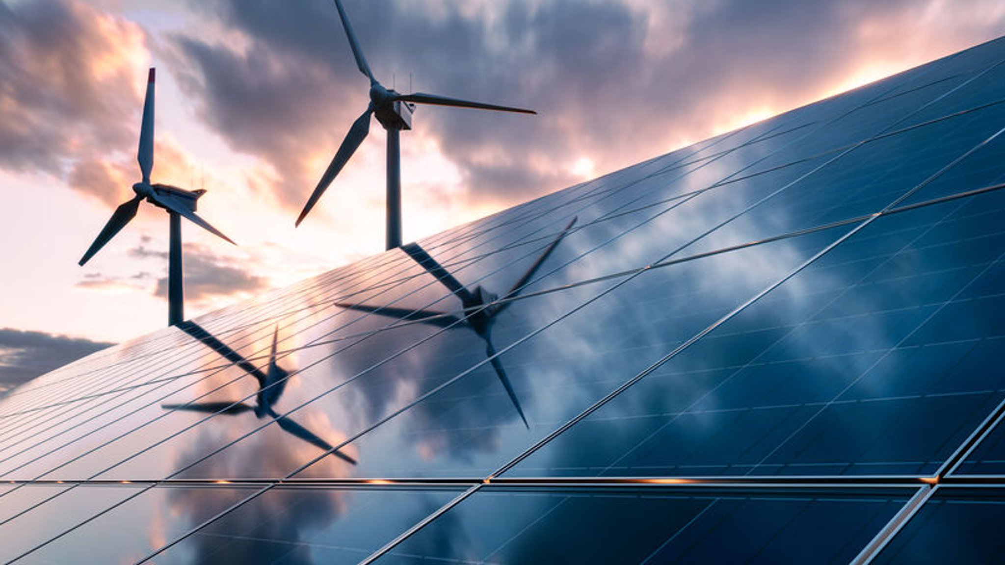 Erneuerbare Energien: Eine Photovoltaikanlage und zwei Windkraftanlagen in einer ländlichen Umgebung.