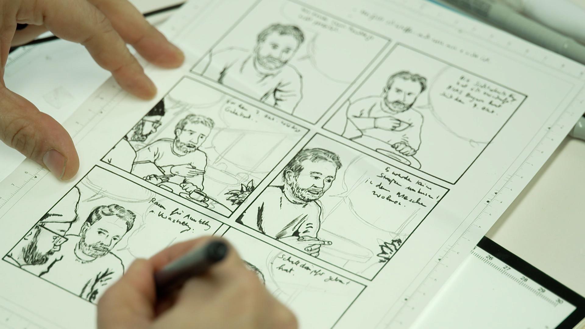 Eine Hand zeichnet eine Comicfigur.