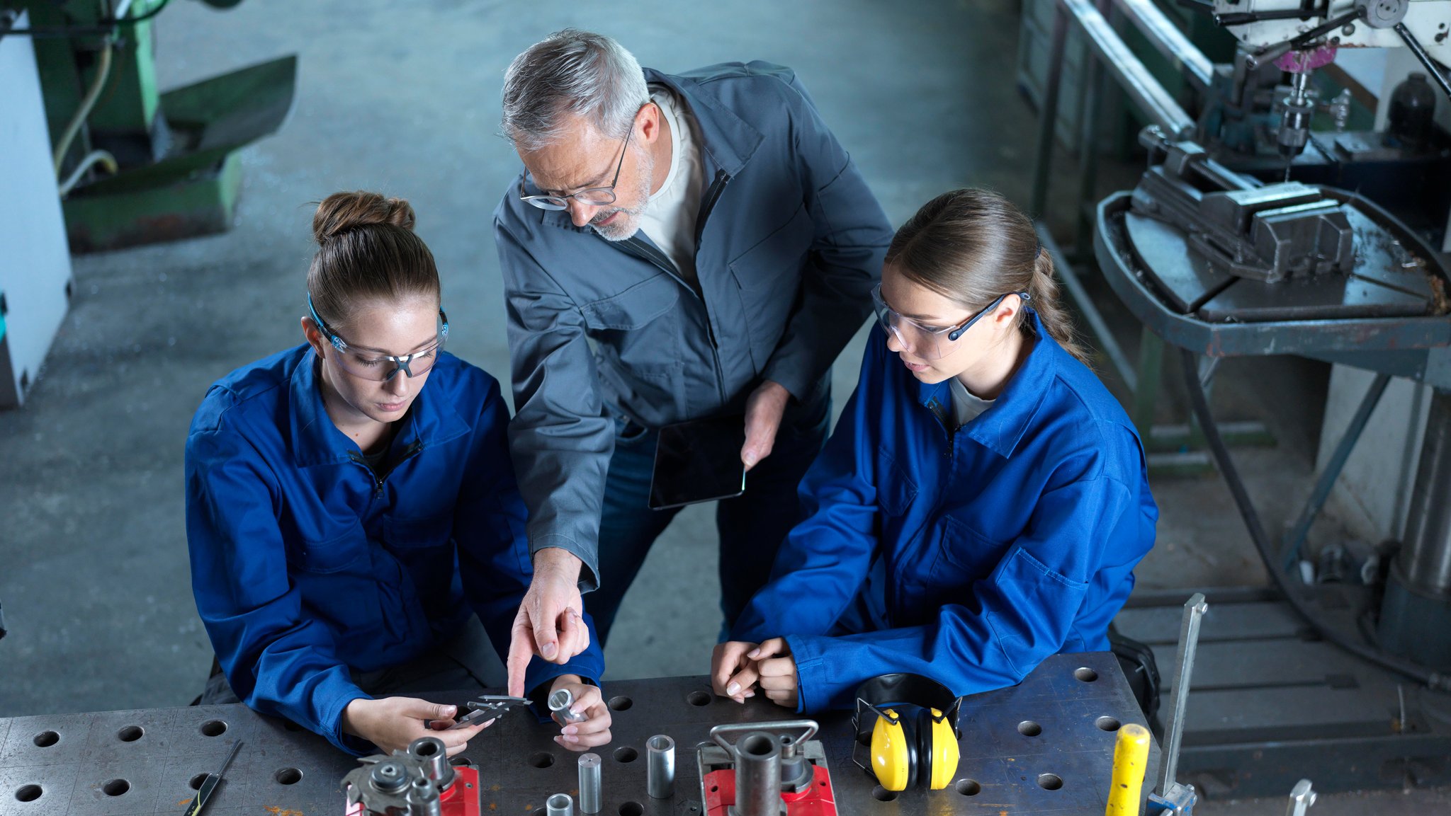 Instructor assisting trainees.