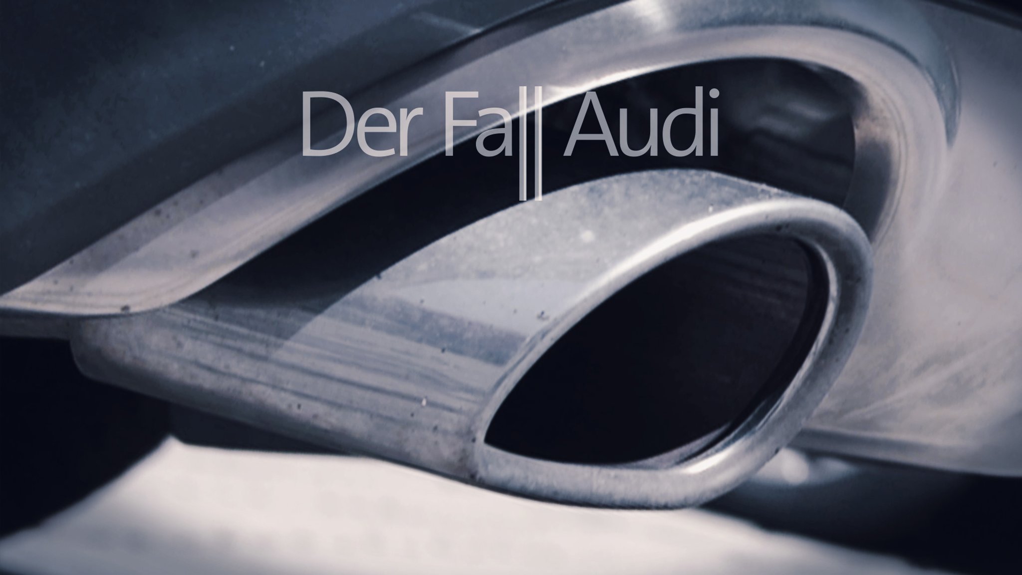 Der Auspuff eines Audis, darüber steht: "Der Fall Audi"