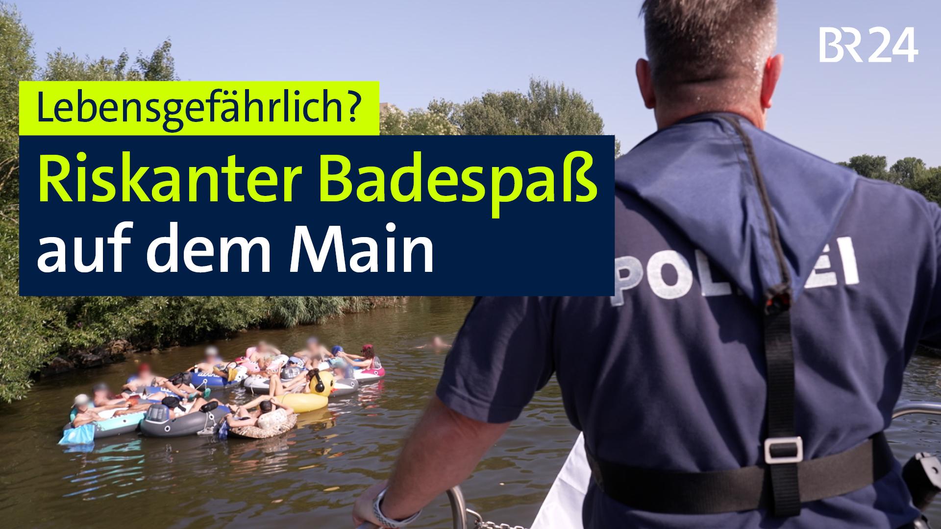 Polizist fährt auf Gruppe Badender mit Schwimmreifen zu