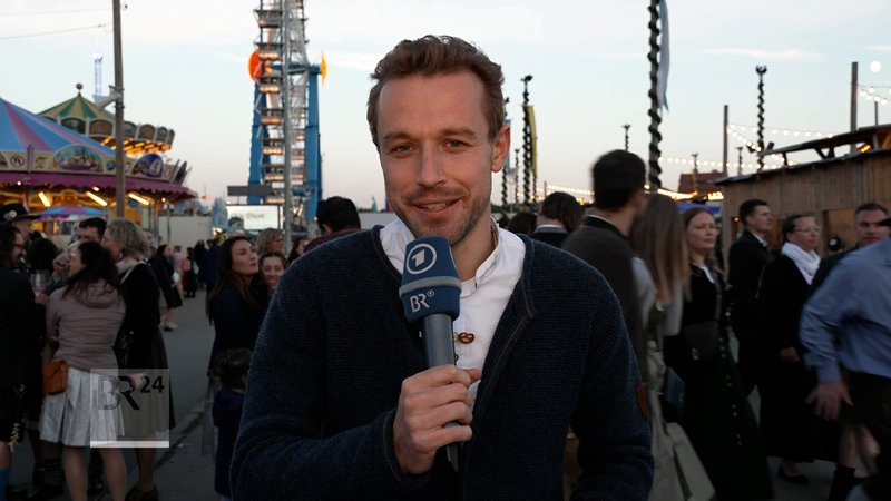 BR-Reporter Manuel Rauch berichtet von der Münchner Theresienwiese über die Lage auf dem Oktoberfest. | Bild: BR BR-Reporter Manuel Rauch berichtet von der Münchner Theresienwiese über die Lage auf dem Oktoberfest.