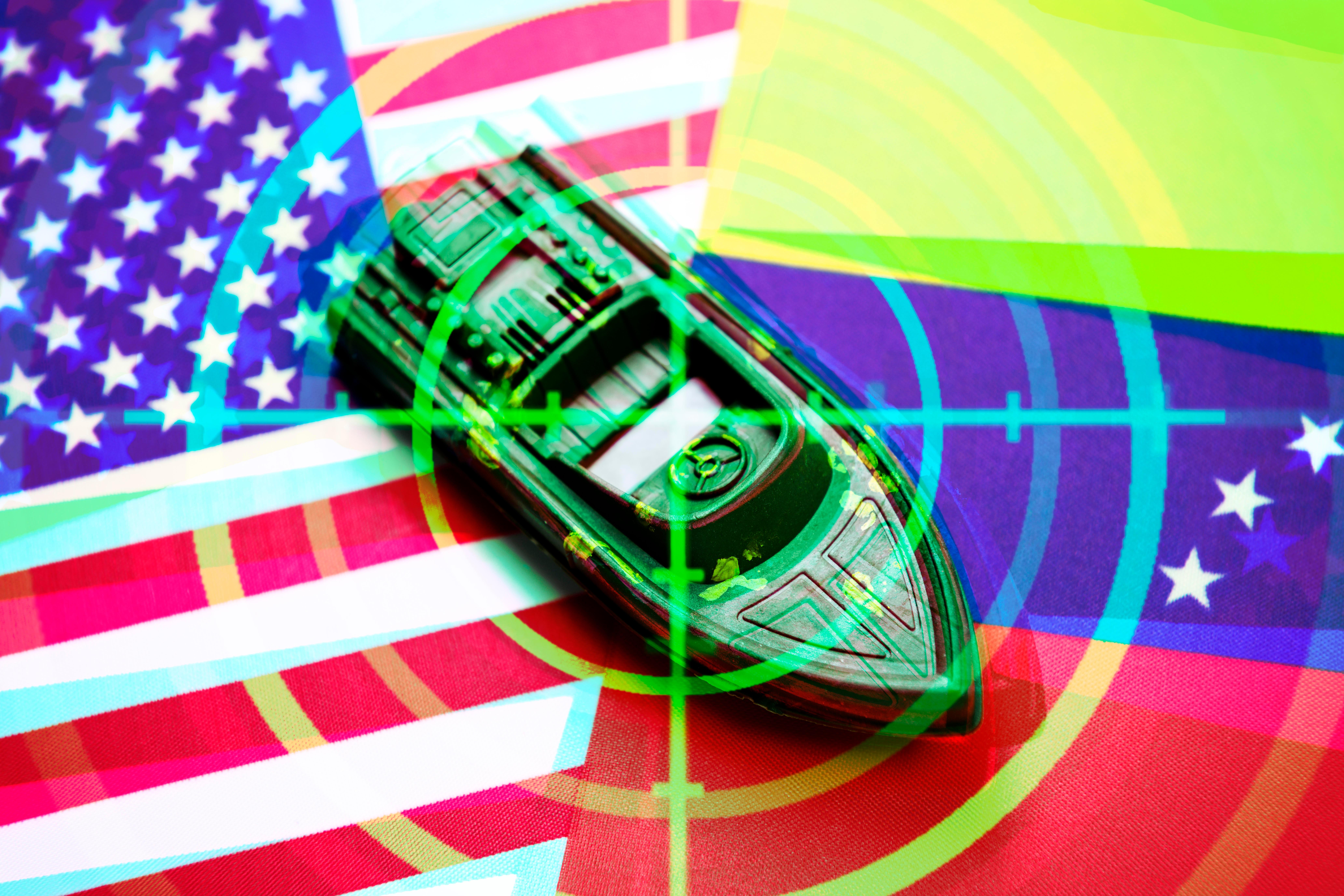 Fotomontage: Boot auf den Fahnen von USA und Venezuela mit Fadenkreuz.