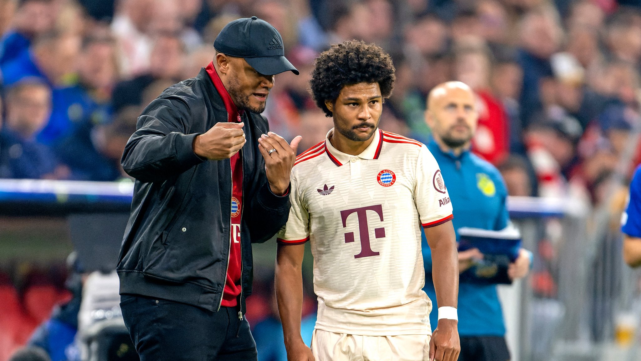 Vincent Kompany (l.) und Serge Gnabry