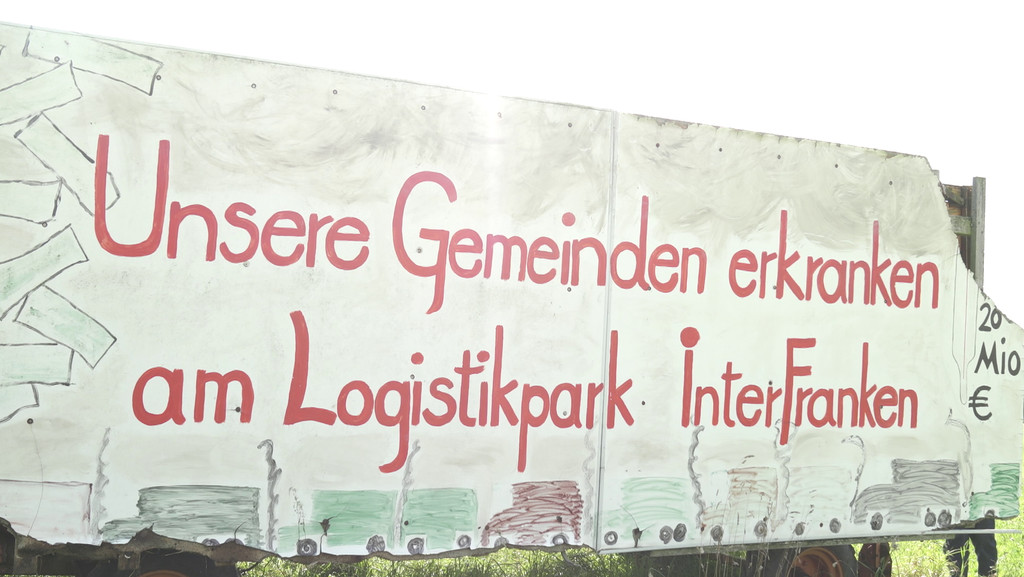 Schild "Gemeinden erkranken an Logistikpark Interfranken"
