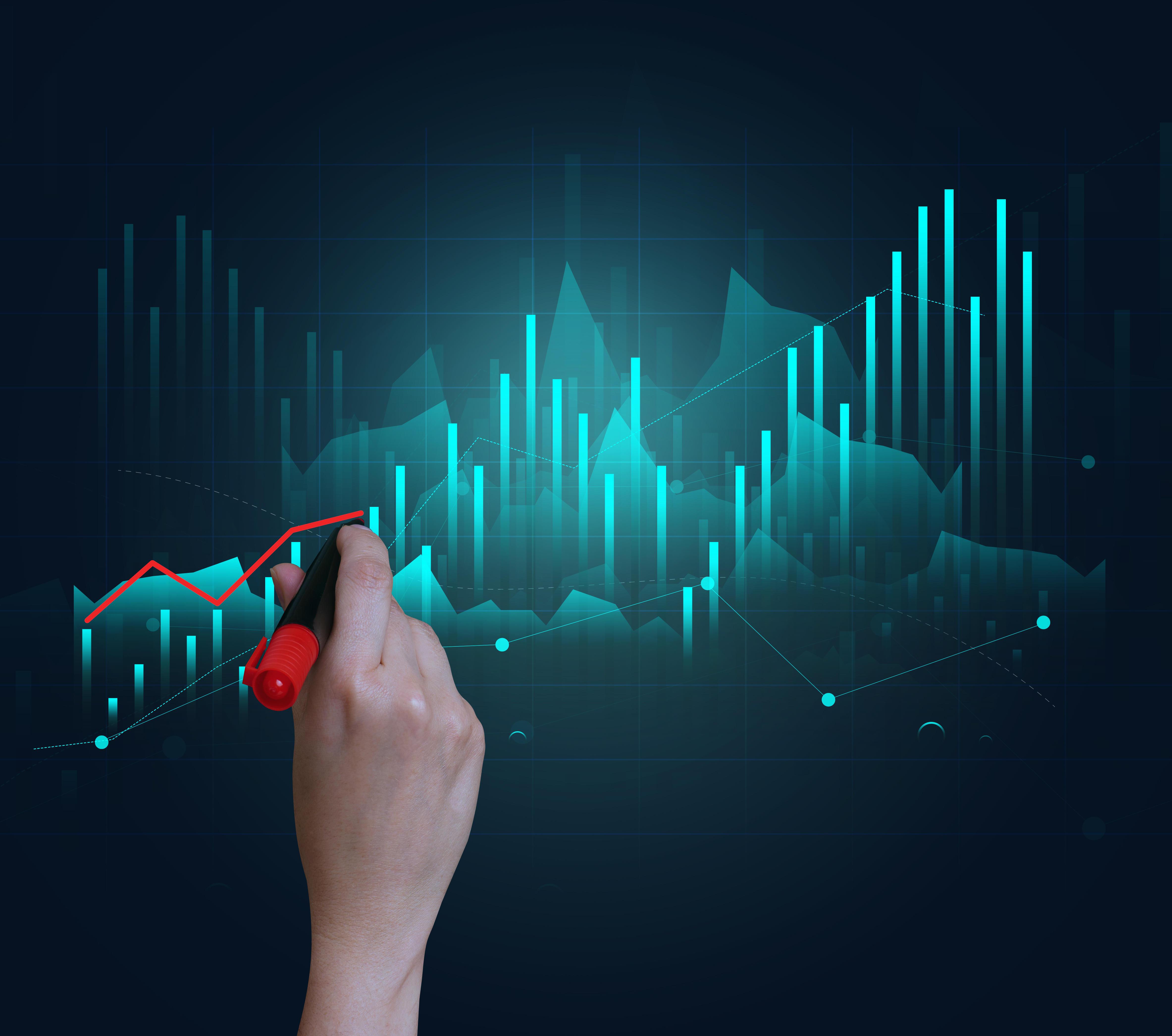 Holographic graph with growing indicators and a woman's hand.