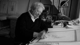 Der Zeichner Jean-Jacques Sempé bei der Arbeit an seinem Zeichentisch | Bild:dpa-Bildfunk/Stephane De Sakutin