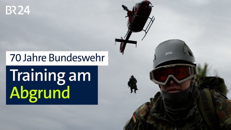 Zu sehen ist ein Helikopter, im Vordergrund Sophie mit Helm und Skibrille. | Bild: BR/Kilian Neuwert/Melina Eisemann Zu sehen ist ein Helikopter, im Vordergrund Sophie mit Helm und Skibrille.