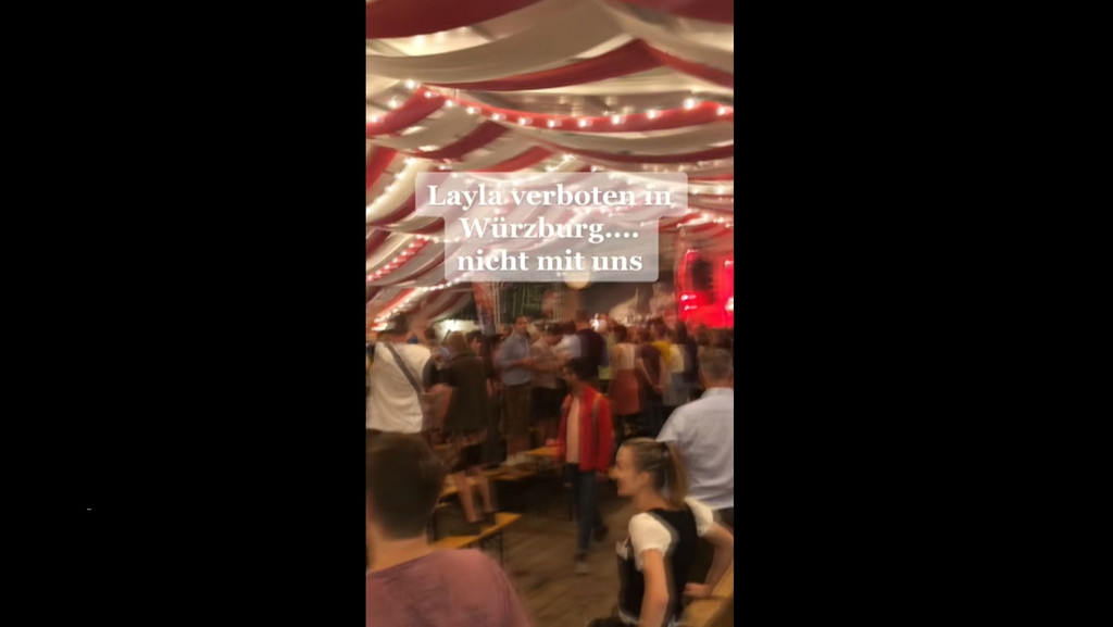 Der Streit um den Nummer 1-Hit "Layla" geht in die nächste Runde. Von der Stadt Würzburg verboten, fordern die Bierzelt-Besucher auf dem "Kiliani"-Volksfest das Lied lautstark ein. | Bild: BR Der Streit um den Nummer 1-Hit "Layla" geht in die nächste Runde. Von der Stadt Würzburg verboten, fordern die Bierzelt-Besucher auf dem "Kiliani"-Volksfest das Lied lautstark ein.