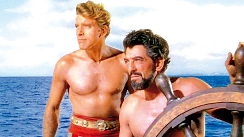Zwei Männer auf einem Boot blicken in die Ferne: Szene aus "Der rote Korsar"