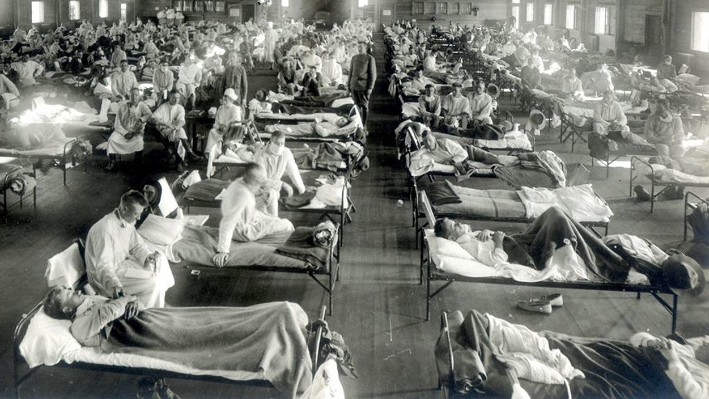 Patienten, die an der Spanischen Grippe (Influenza-Pandemie) erkrankt sind, liegen in einem Notfallkrankenhaus im Camp Funston der Militärbasis Fort Riley in Kansas, USA. | Bild: picture-alliance/dpa/National Museum of Health and Medicine Patienten, die an der Spanischen Grippe (Influenza-Pandemie) erkrankt sind, liegen in einem Notfallkrankenhaus im Camp Funston der Militärbasis Fort Riley in Kansas, USA.