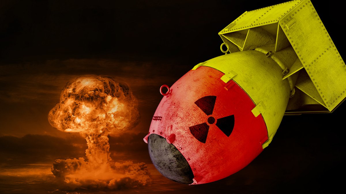 Bildcollage mit einer Atombombe in den deutschen Nationalfarben, im Hintergrund ein Atompilz