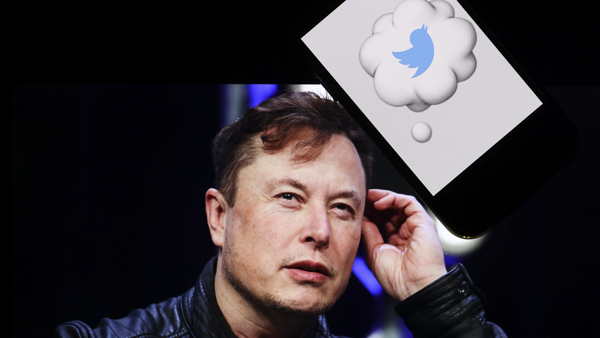 In this photo illustration, the image of Elon Musk is displayed on a computer screen and the logo of twitter on a mobile phone