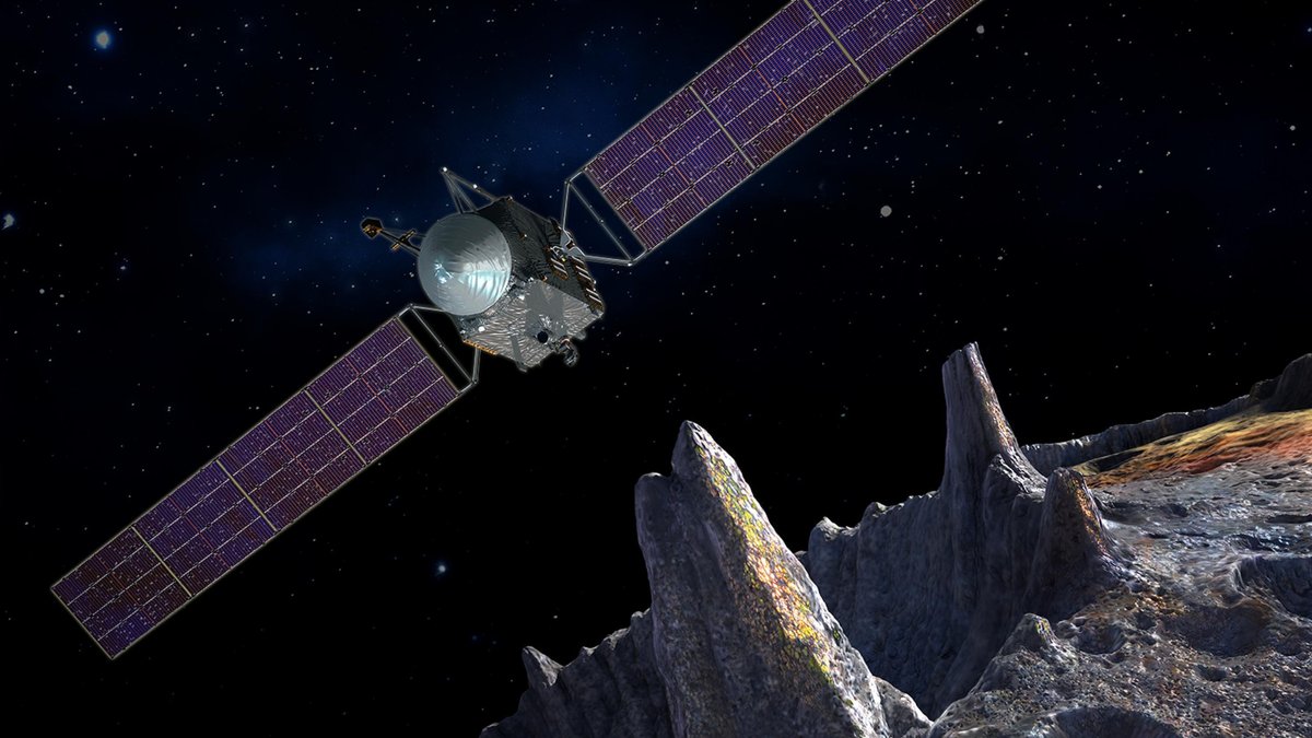 Künstlerische  Darstellung der NASA-Mission Psyche: Die Raumsonde oben links über der Oberfläche des metallhaltigen Asteroiden Psyche unten rechts im Bild. 