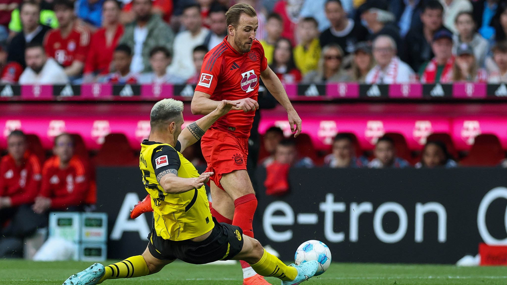Treffen auch am Samstag wieder aufeinander: Harry Kane und Niklas Süle (grätschend).