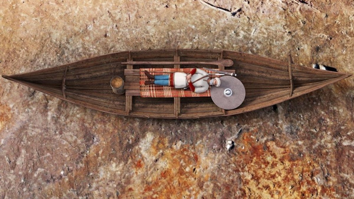 Modellhafte Darstellung der Beerdigung eines Mannes in einem Bootsgrab der Wikingerzeit in Norwegen.
