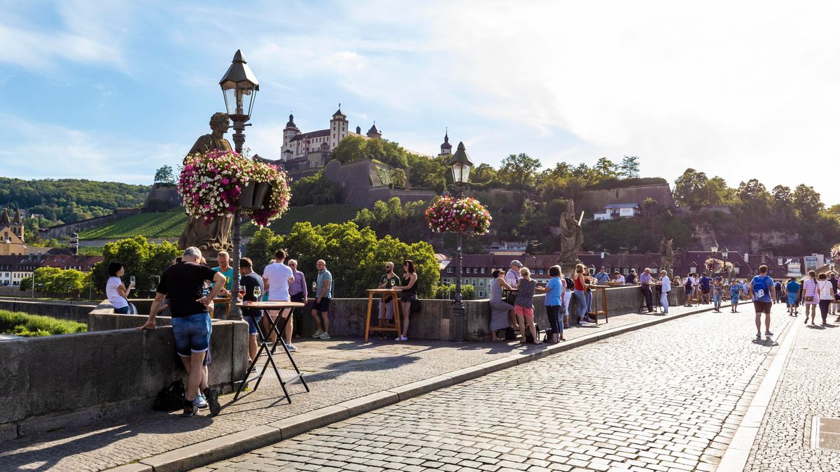 drinking wine on the bridge wurzburg germany