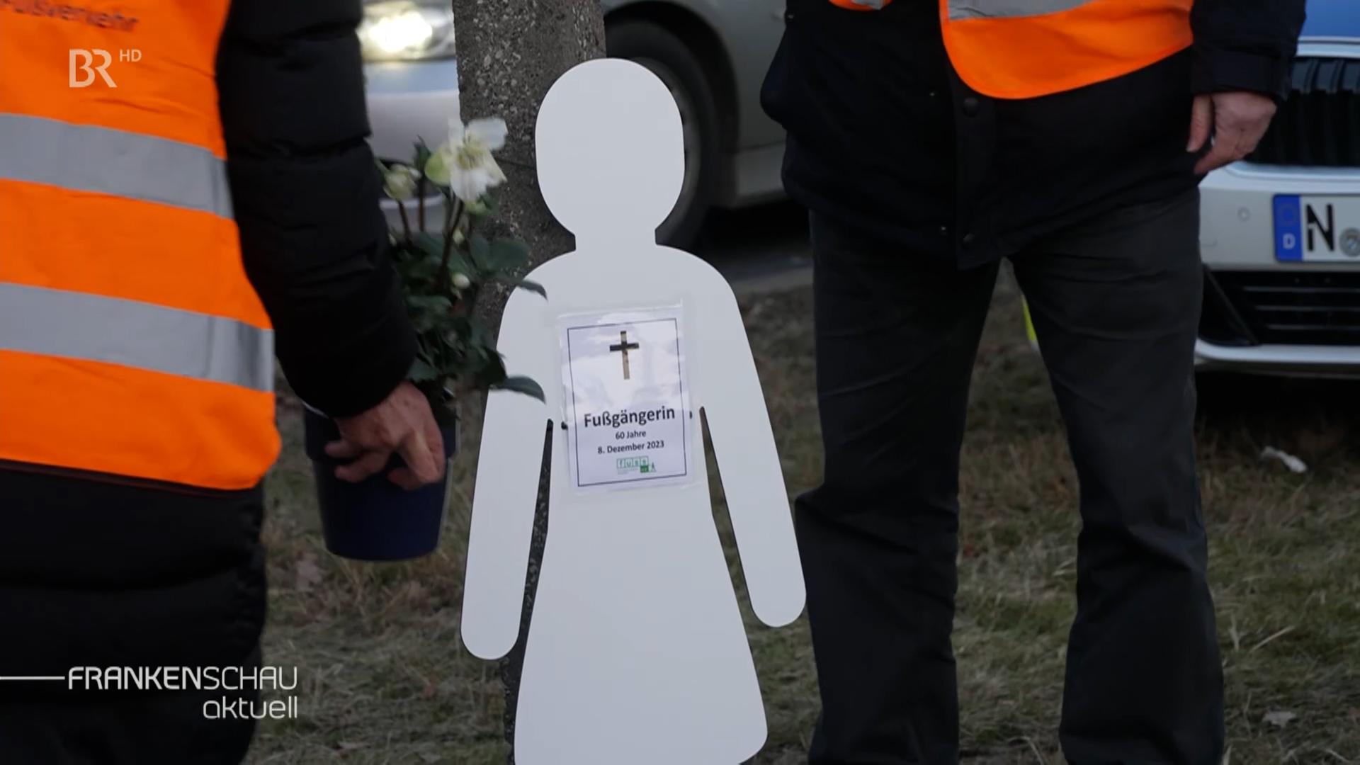 Silhouette eines Fußgängers als Mahnmal.