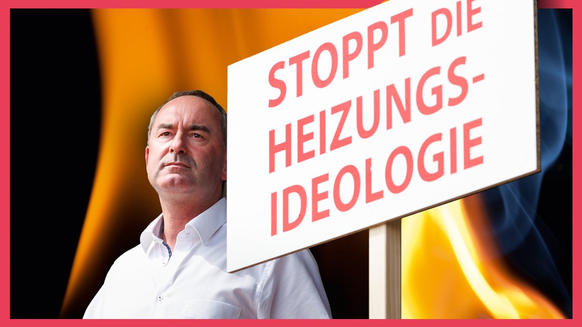 Ein Mann im weißen Hemd, es ist der bayerische Vize-Ministerpräsident Hubert Aiwanger, neben ihm ein Schild mit der Aufschrift "Stoppt die Heizungsideologie".
