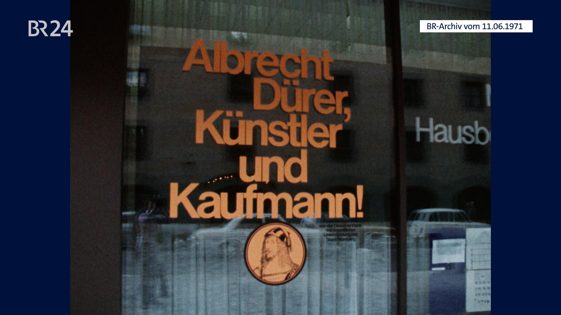 (Archivbild) Schaufenster mit Schriftzug "Albrecht Dürer, Künstler und Kaufmann!"