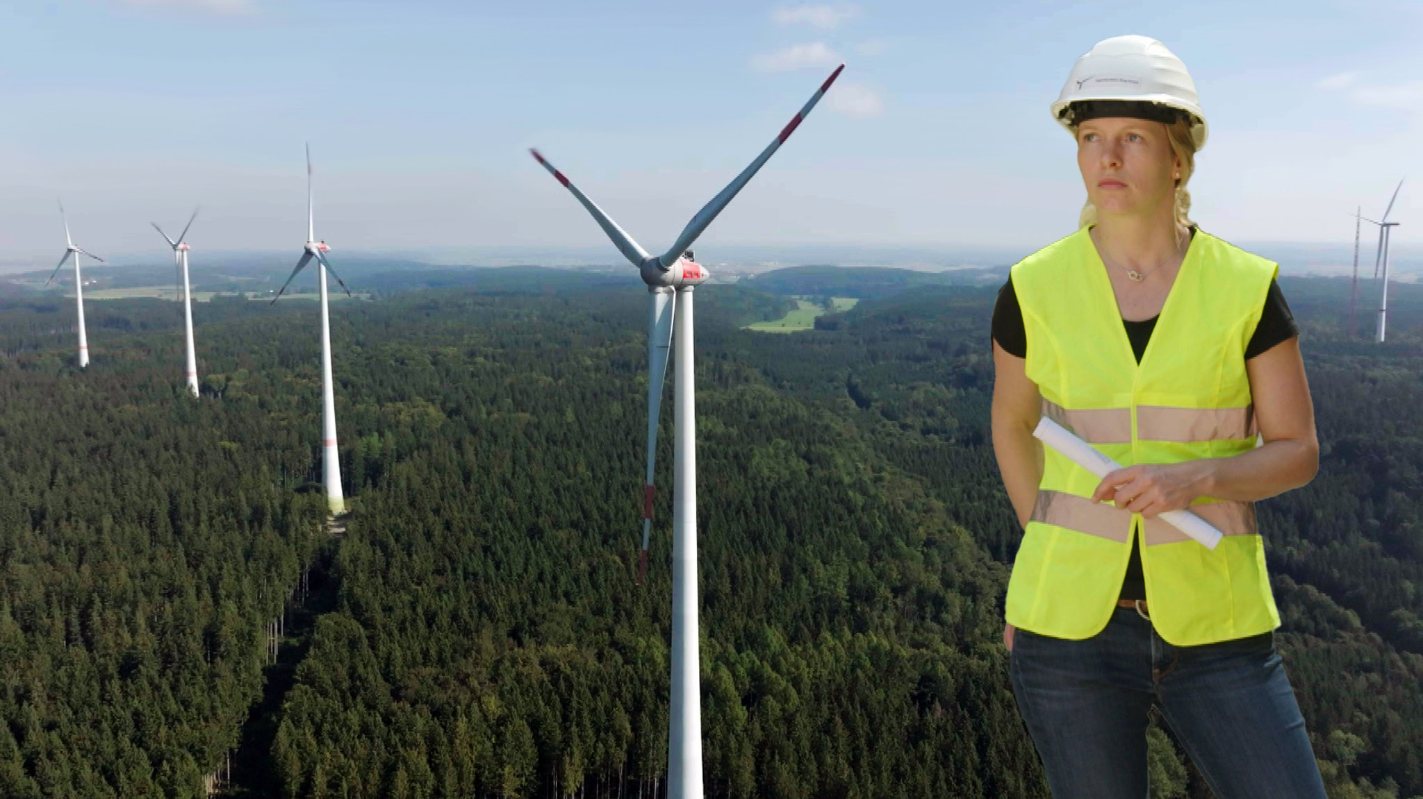 Pia Zordick, im Hintergrund Windräder. Windenergie: Schafft Bayern den Ausbau?