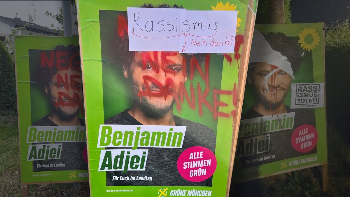 Rassistisch beschmiertes Wahlplakat des Grünen-Landtagsabgeordneten Benjamin Adjei, das von Anwohnern mit einem Zettel überklebt wurde.