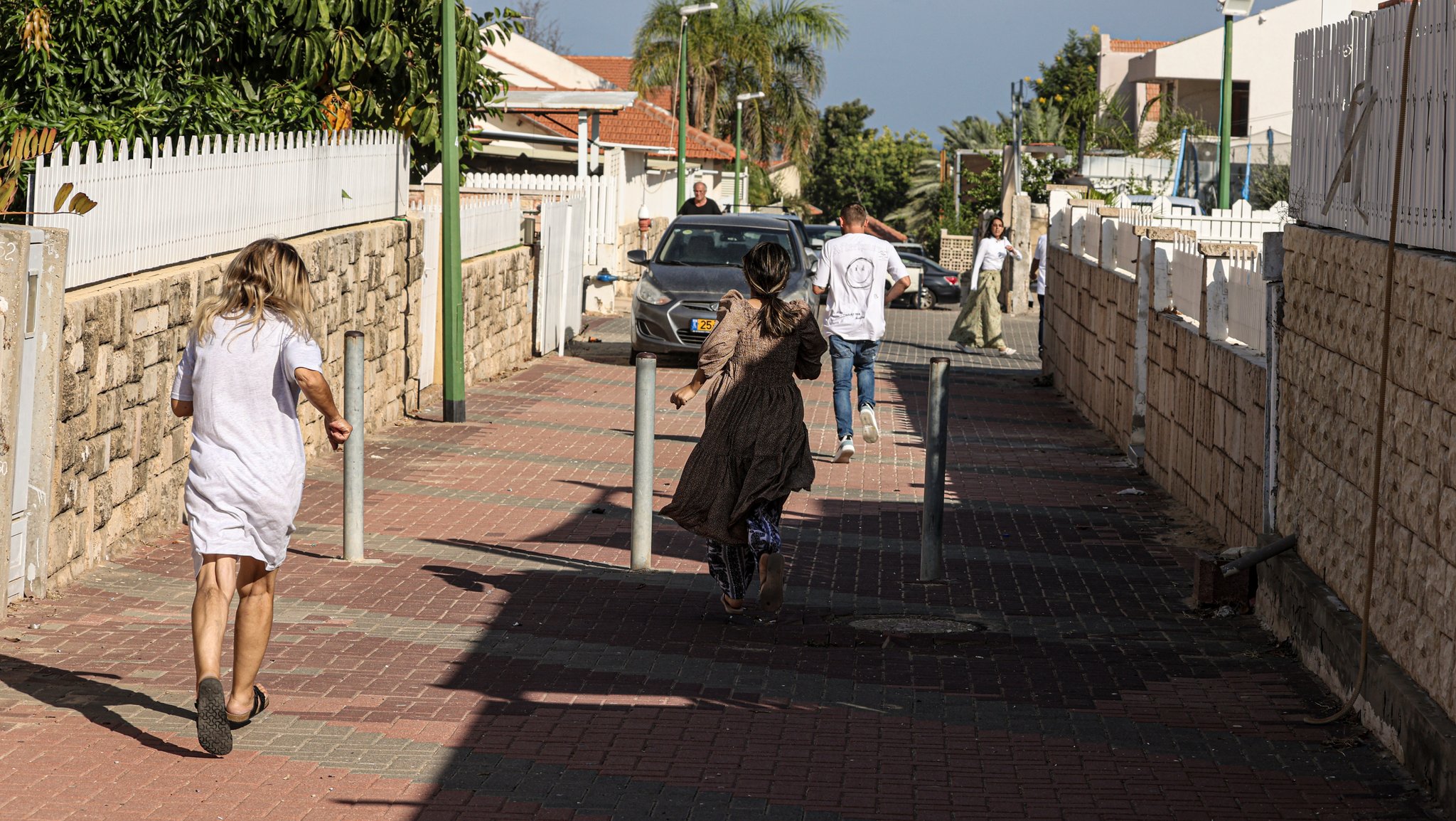 Residents try to take cover during a rocket attack from Gaza. Palestinian militants in Gaza unexpectedly fired dozens of rockets at Israeli targets early on Saturday, the Israeli army said. 