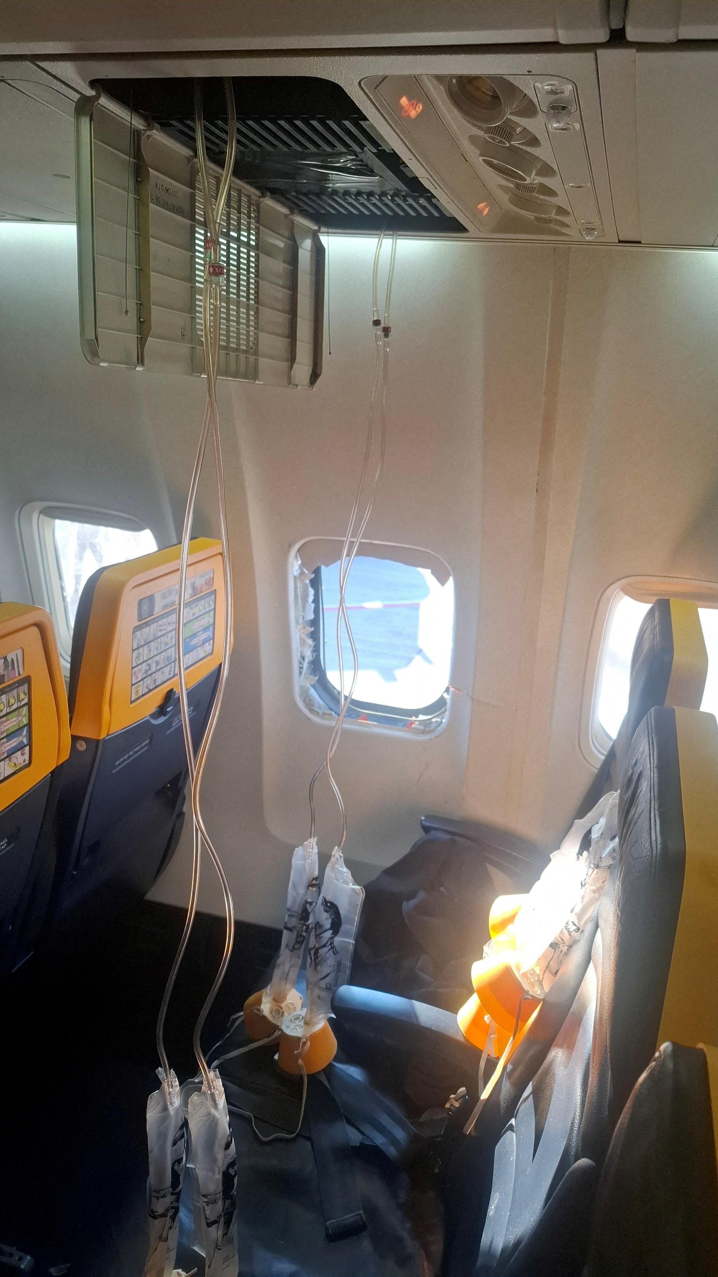 Ryanair passenger almost sucked out of plane - | the background